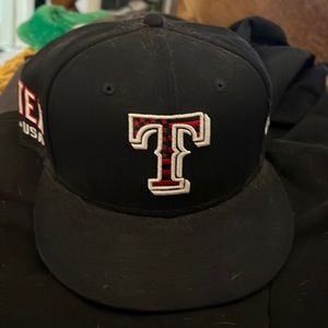Navy blue and red Texas Rangers hat